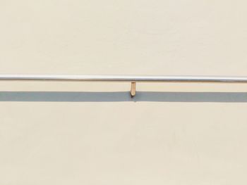 Railing against wall