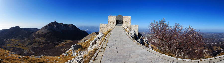 Panoramic view of historic building against blue sky