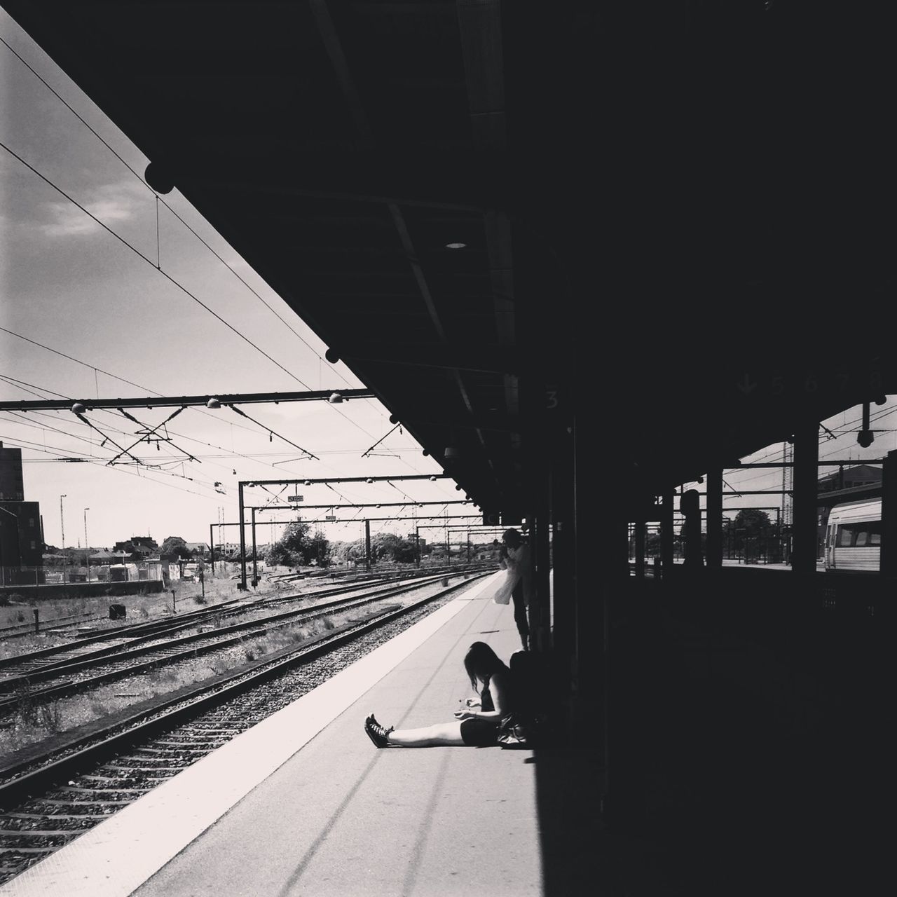 transportation, railroad track, railroad station platform, railroad station, public transportation, rail transportation, built structure, architecture, connection, bridge - man made structure, travel, sky, train - vehicle, mode of transport, men, incidental people, indoors, on the move