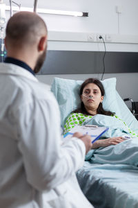 Doctor examining patient in clinic