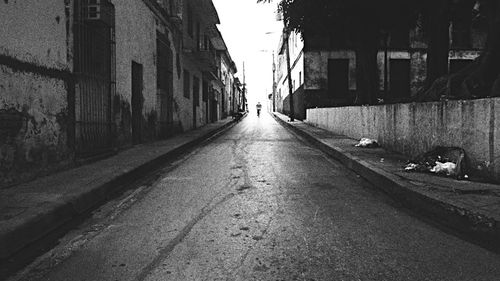 Narrow road along buildings
