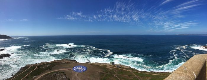 Scenic view of sea against blue sky