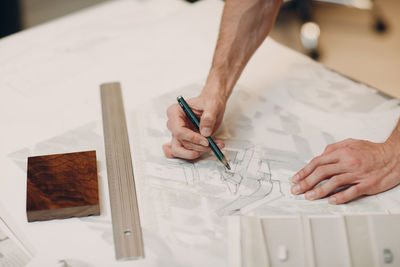 High angle view of man working on table