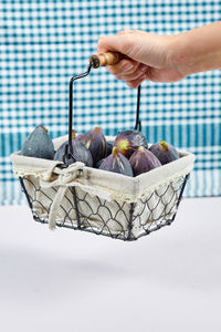 Close-up of hand holding ice cream basket