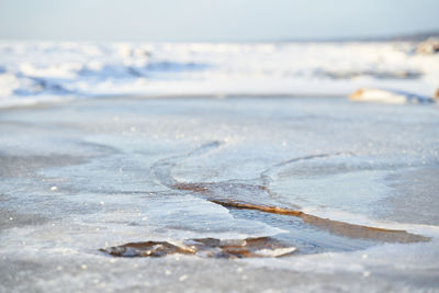 Close-up of snow on beach