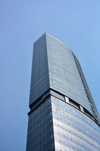 Low angle view of modern building against clear blue sky