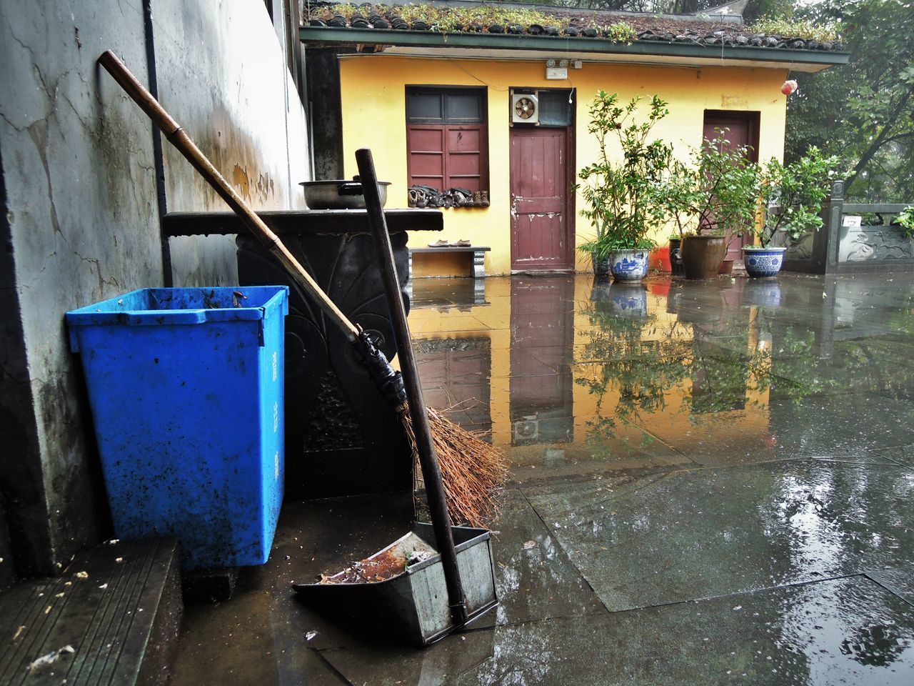 REFLECTION OF BUILDING ON WET RAINY SEASON