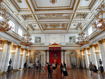 People walking in historic building