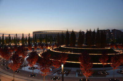 High angle view of illuminated building against sky during sunset