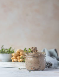 Close-up of ice cream in jar on table