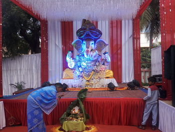 Group of people in temple outside building