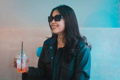 Anisa narsila enjoying a drink in a cafe at flavor bliss alam sutera