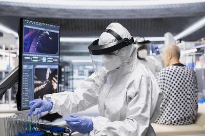 Rear view of man working at clinic
