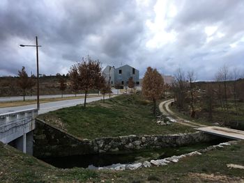 Scenic view of building against cloudy sky