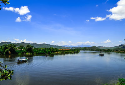 Scenic view of calm lake against mountain range