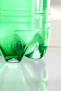 Close-up of empty glass bottle on table