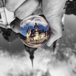 Close-up of hand holding crystal ball