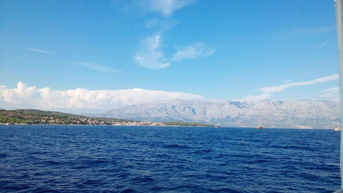 Scenic view of sea against blue sky