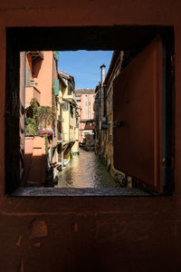 Alley amidst buildings in city