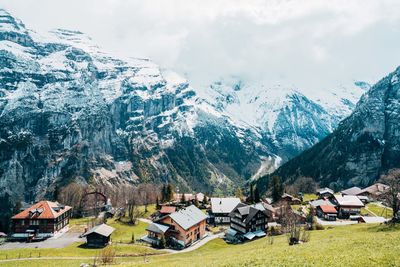 Panoramic view of buildings and mountains against sky