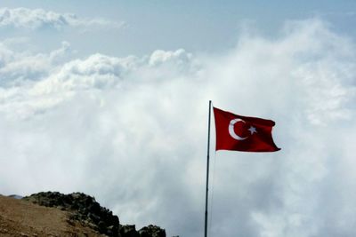 Low angle view of flag against sky