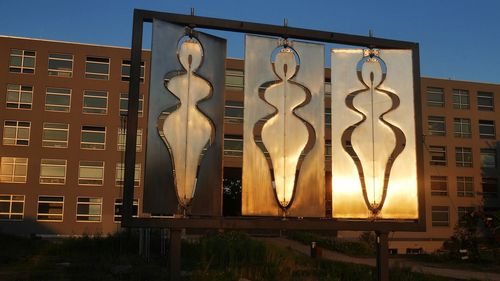Low angle view of illuminated building against sky
