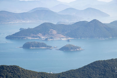 Panoramic view of sea and mountains against sky