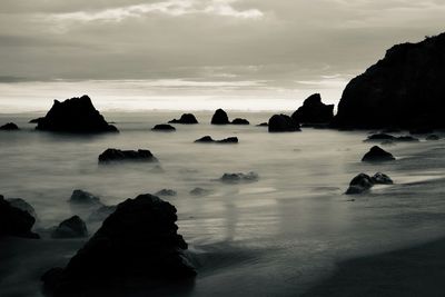 Rocks on sea against sky