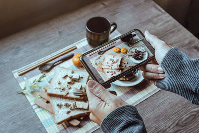 High angle view of person preparing food on table