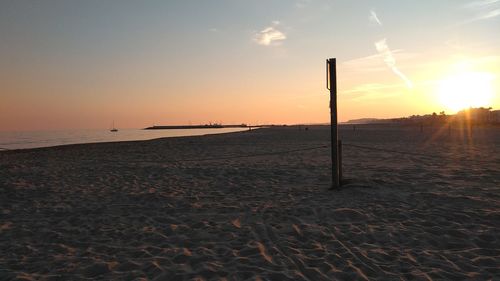 Scenic view of beach against sky during sunset