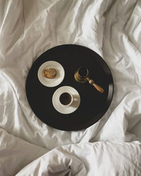 High angle view of breakfast on bed