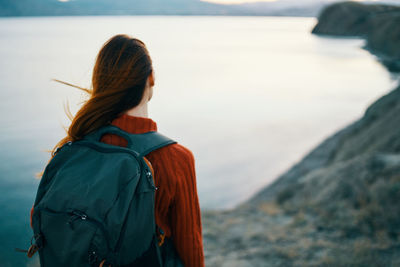 Rear view of woman looking at sea