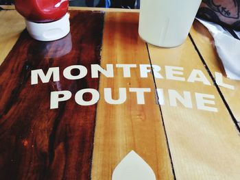 High angle view of information sign on table