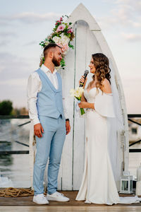 Couple holding umbrella