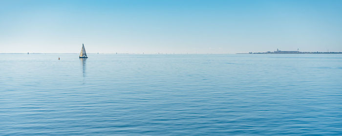 Scenic view of sea against clear sky