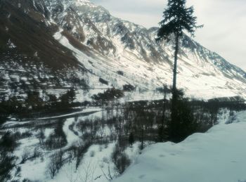 Scenic view of snow covered mountains