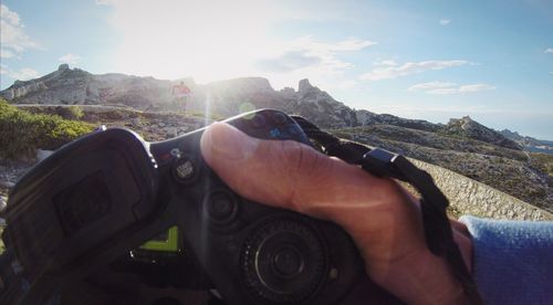 Cropped image of person on mountain road