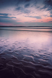 Scenic view of sea against dramatic sky