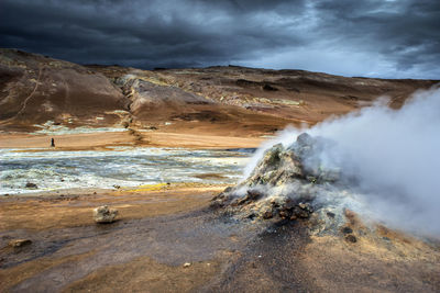 View of geyser against sky during sunset