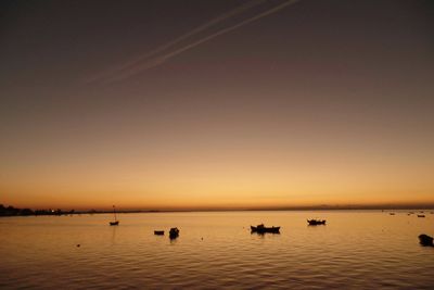 Scenic view of sea against clear sky during sunset