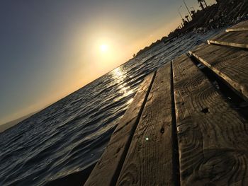 View of calm beach at sunset