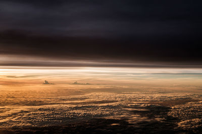 Aerial view of landscape against sky during sunset