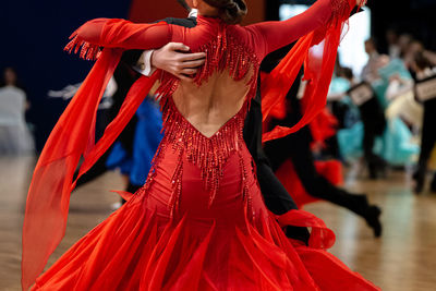 Close up female dancer in red ball gown