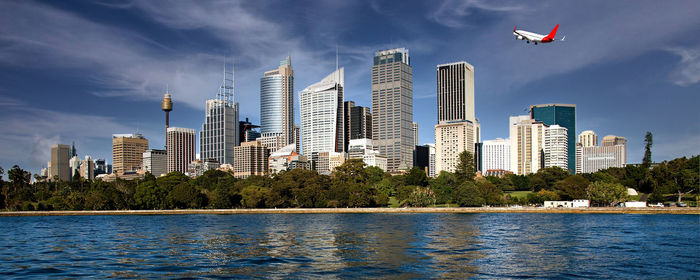 Modern buildings in city against sky