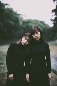 Portrait of a young woman standing outdoors