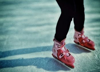 Low section of woman standing on tiled floor