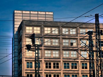 Low angle view of office building against sky