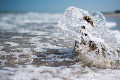 Sea waves splashing on shore