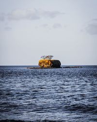 View of boat in sea against sky