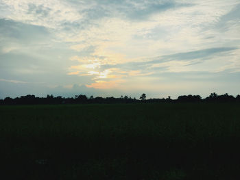 Scenic view of field against sky during sunset